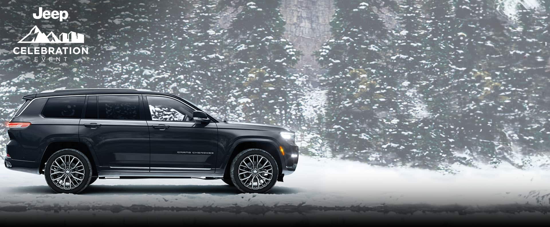 An angled passenger-side profile of a gray 2024 Jeep Grand Cherokee Summit Reserve parked on a snow-covered trail, with evergreen trees in the background. Jeep. Jeep Celebration Event logo.